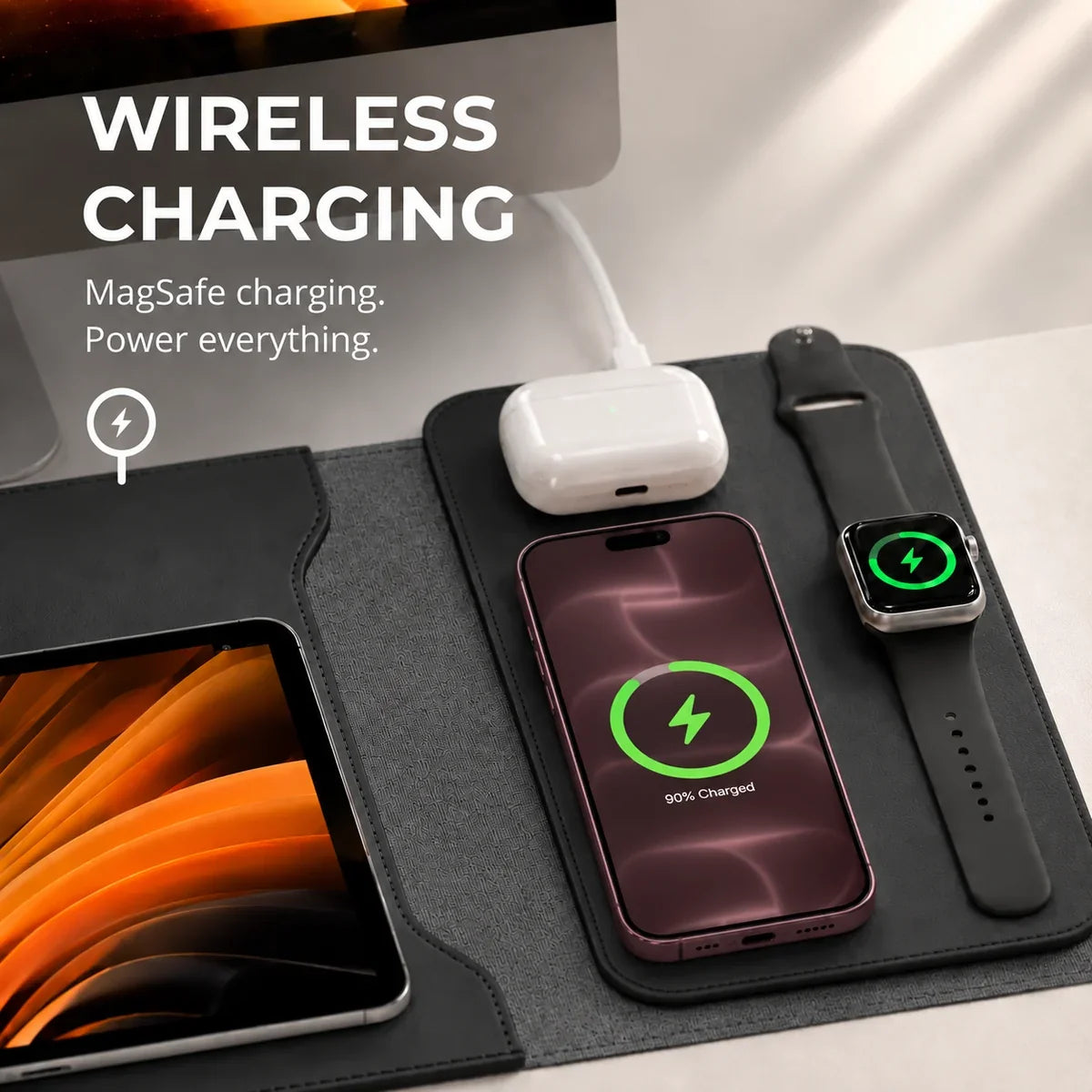 Midnight Black wireless charging laptop sleeve with devices charging on the side panel. #color_Midnight Black