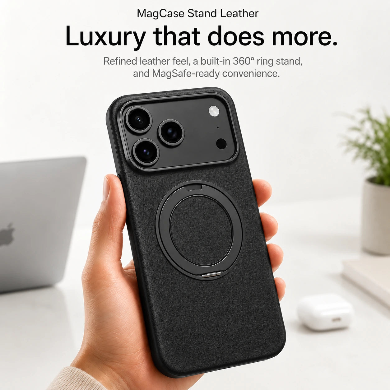 Black leather phone case held upright at a desk with the ring stand folded flat #color_Midnight Black