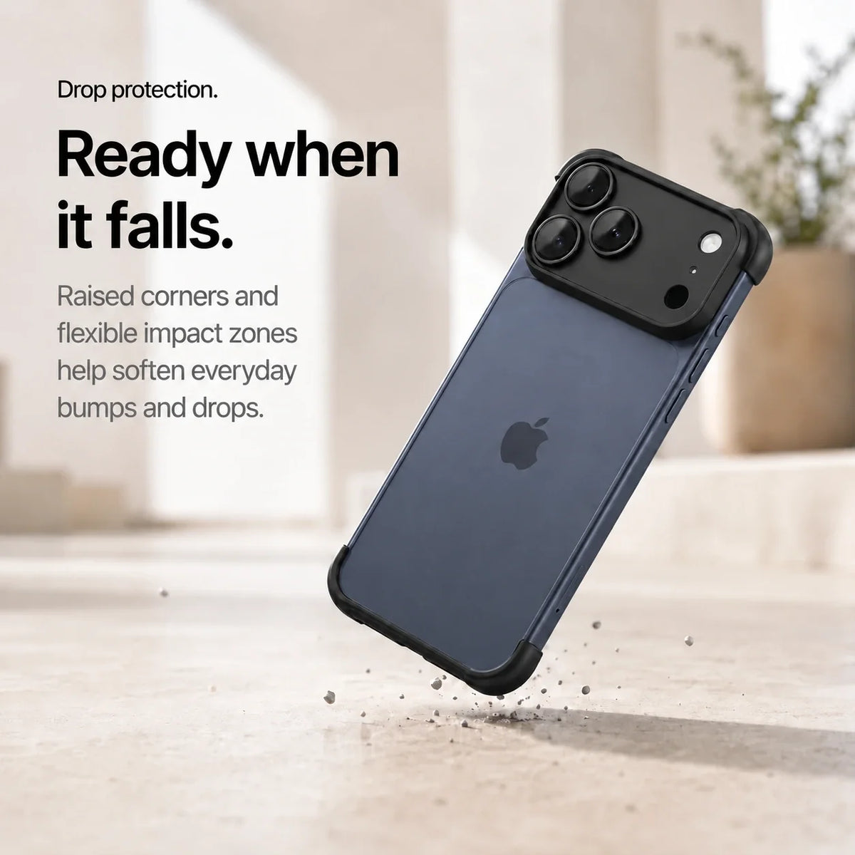 Black phone bumper shown landing on a protected corner above a stone surface #color_Midnight Black