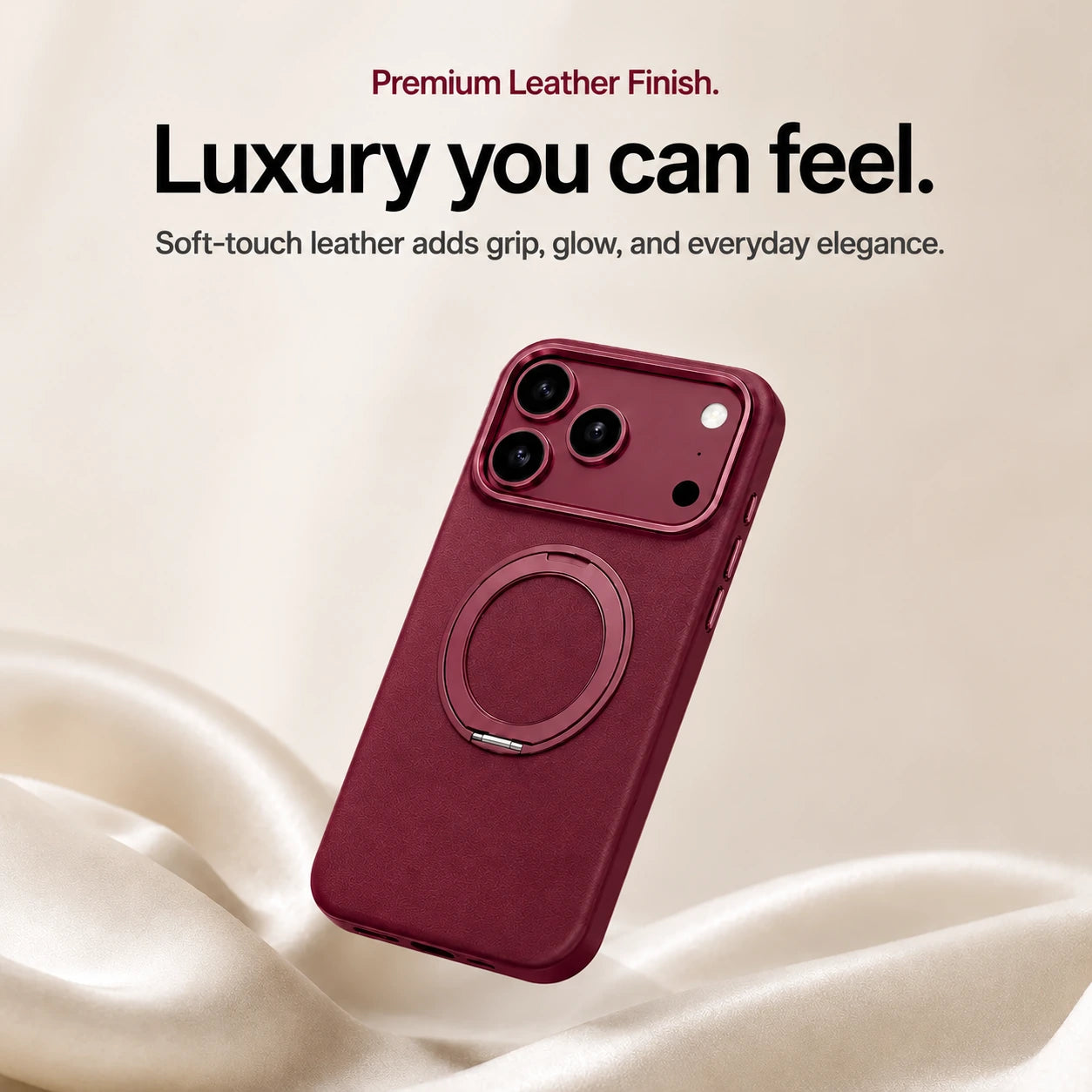 Burgundy leather phone case with a closed ring stand above soft cream fabric #color_Cherry Red