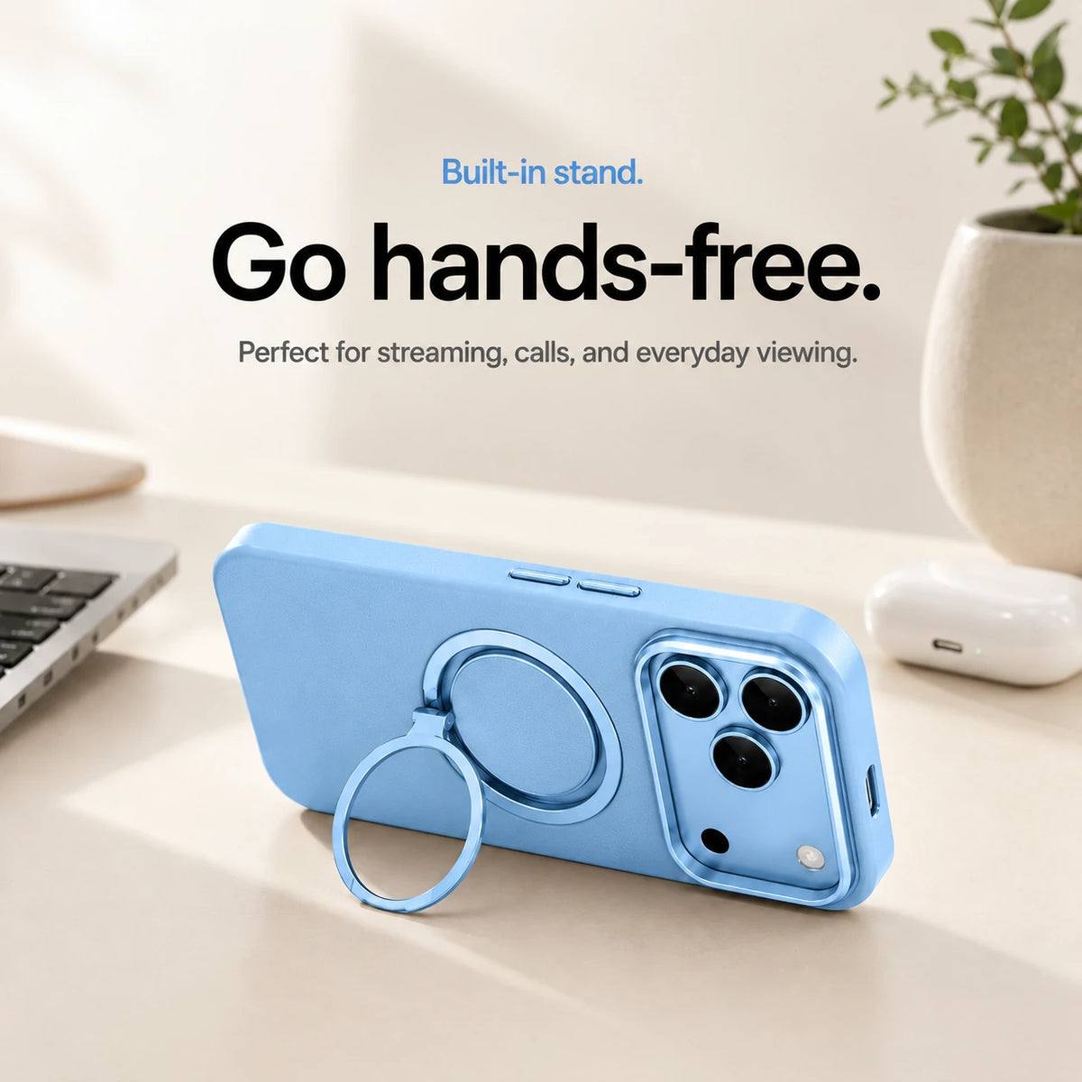 Light blue leather phone case propped horizontally on its ring stand beside a laptop #color_Light Blue