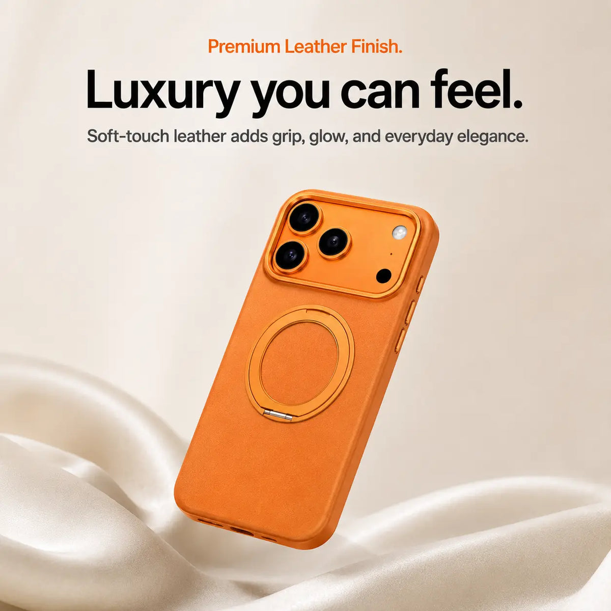 Orange leather phone case with a closed ring stand above soft cream fabric #color_Cosmic Orange