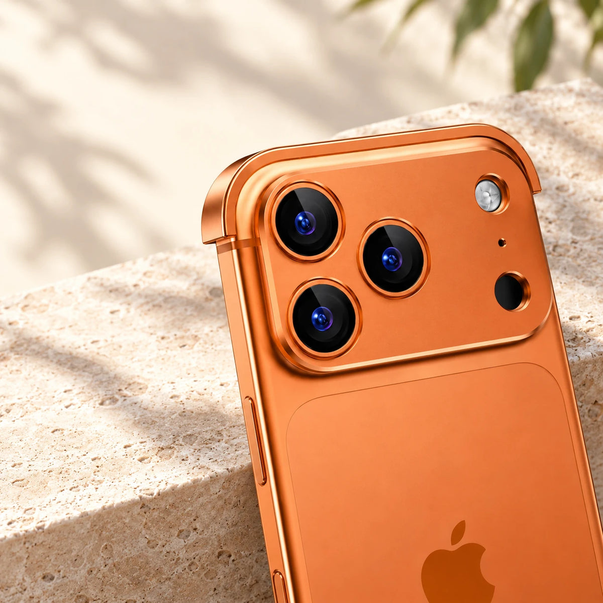 Close-up of the raised orange metal camera surround and three rear lenses.
